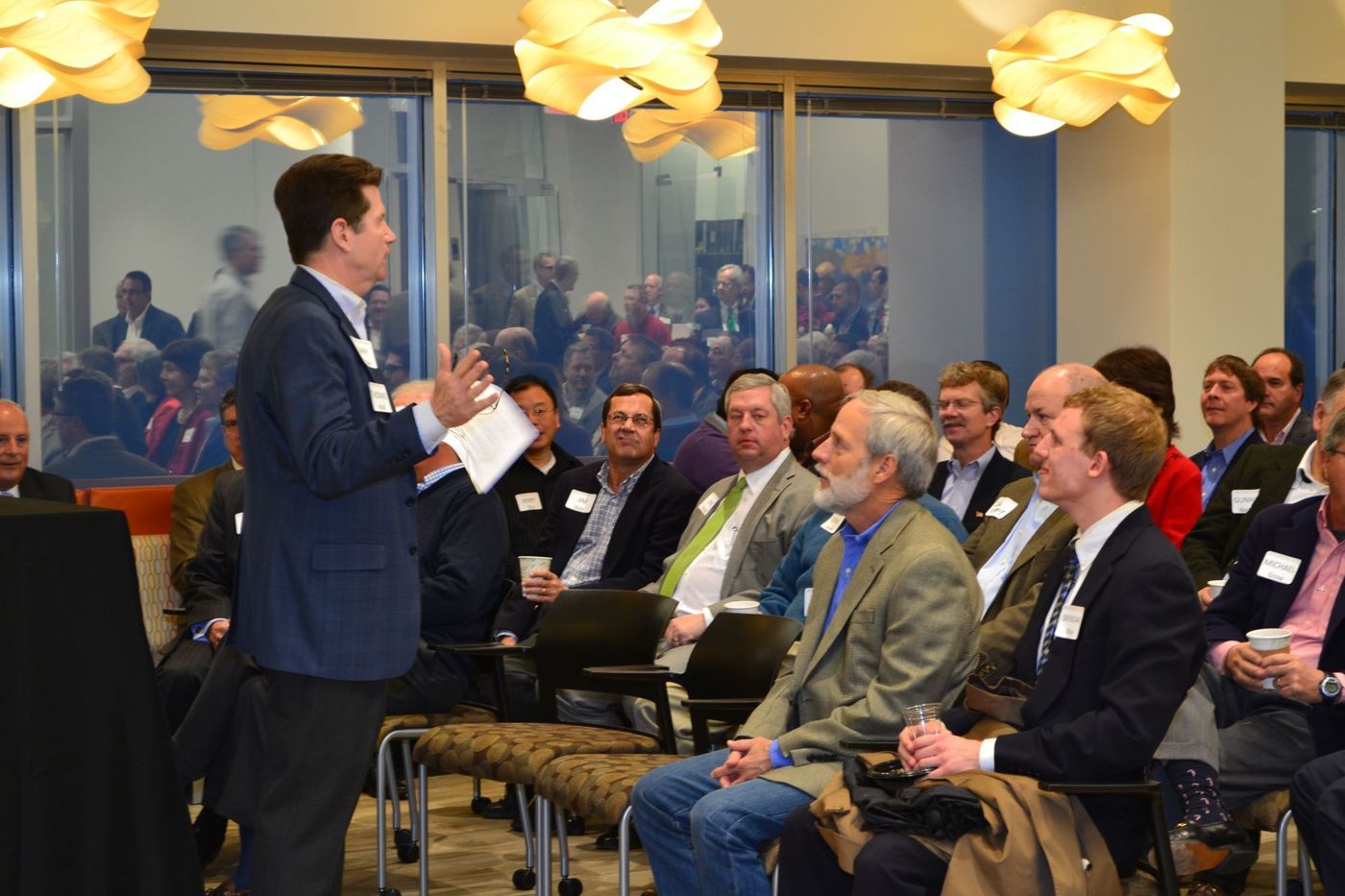 An encorepreneur! speaker addresses a packed breakfast audience